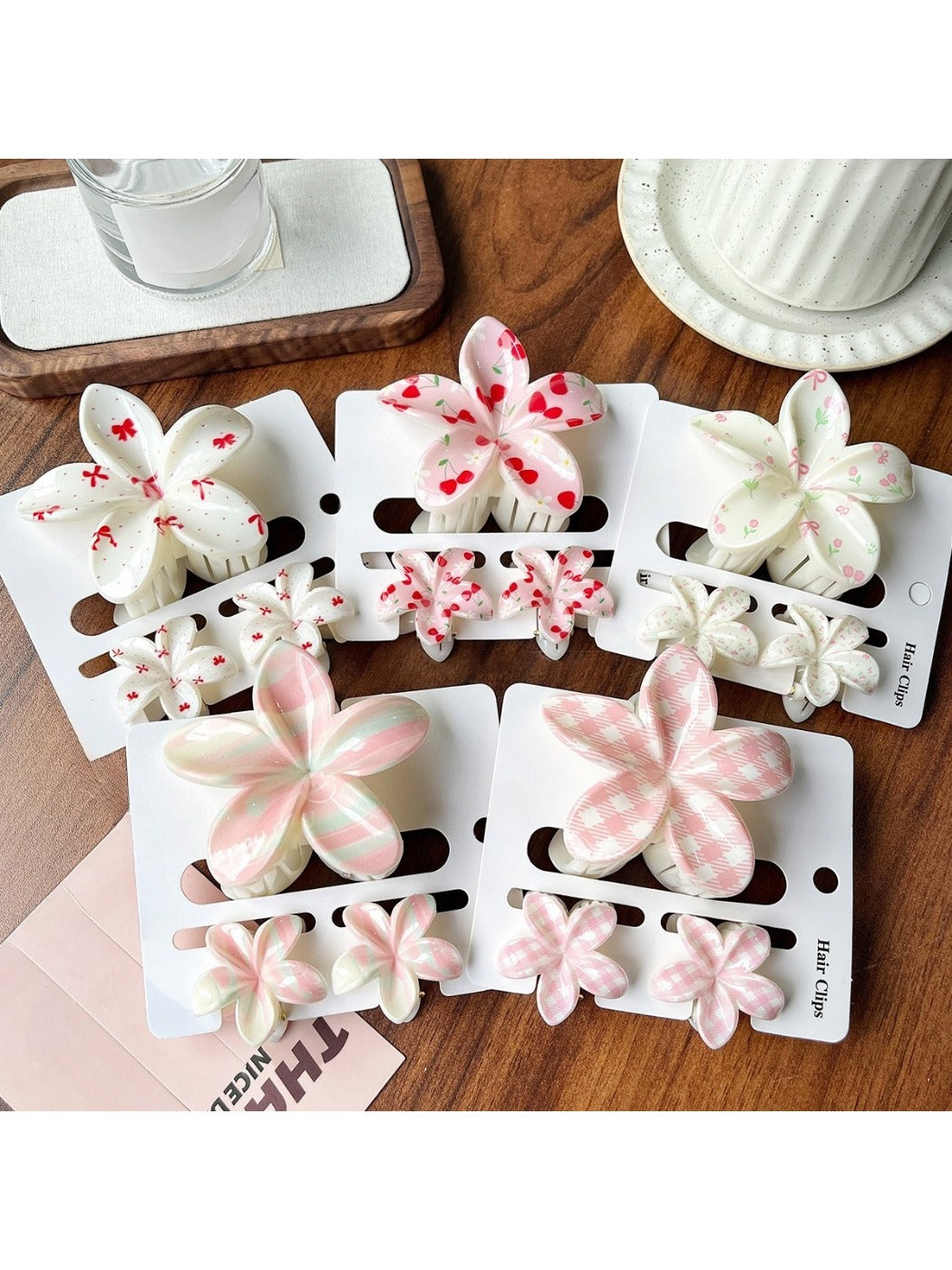 Beau flower shaped claw clip in pastel pink on white background