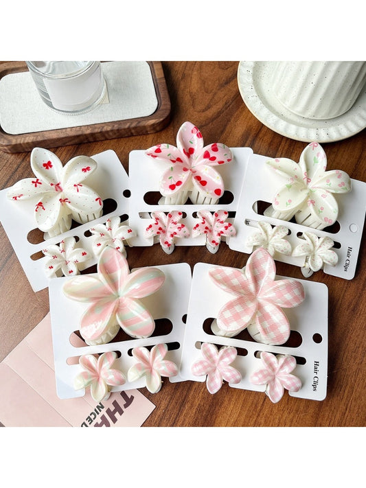 Beau flower shaped claw clip in pastel pink on white background