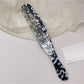 Camerow long handle hair comb with glossy finish reflecting light
