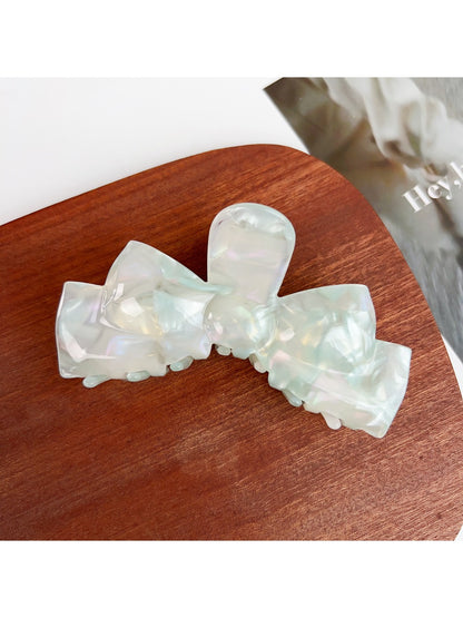 Beau classic bow shaped hair claw clip angled to show clip teeth