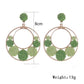 Side view of Sweet Raffia Circle Stud Earrings showing earring post