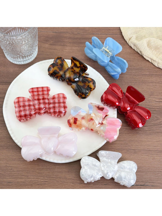 Beau bow shaped hair claw clip in glossy tortoiseshell pattern