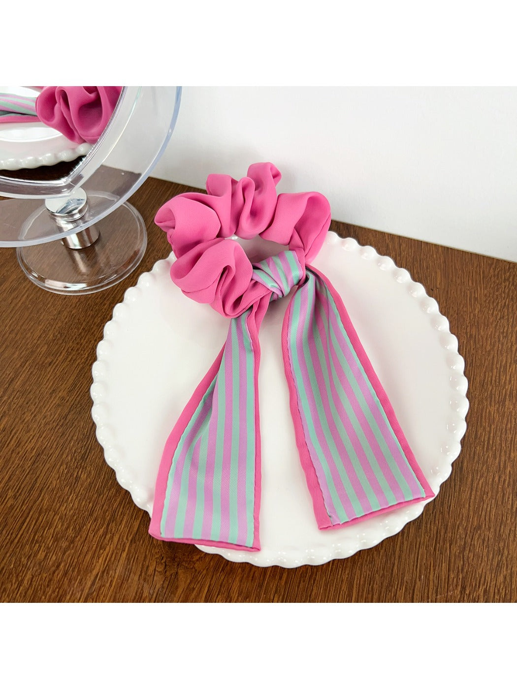 Scrunchie in natural light showing vibrant magenta colors