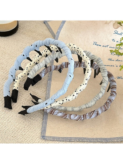 Polka dot headband in black and white with a simple knot design