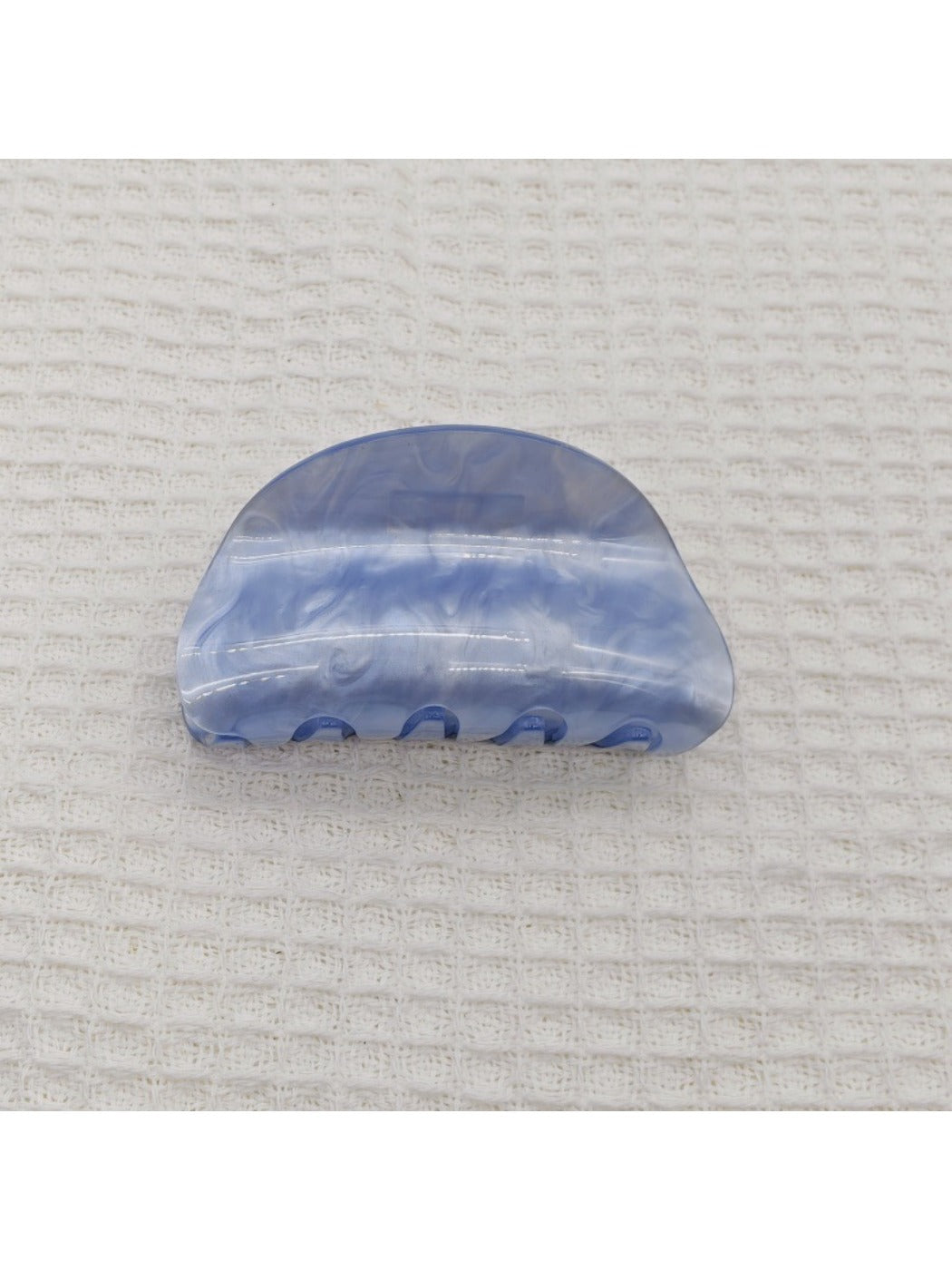 Beau marble pattern claw clip photographed with natural lighting