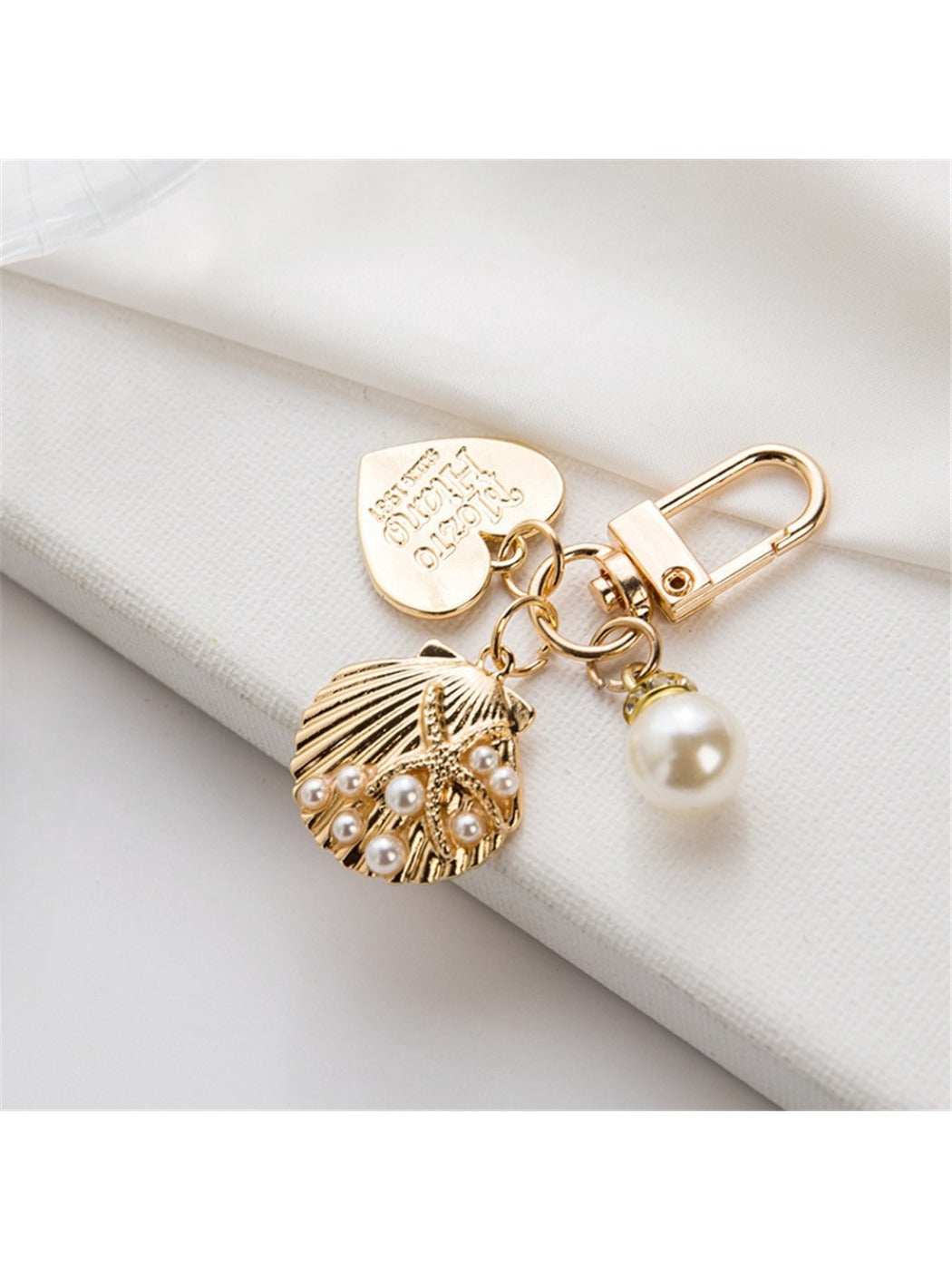 Top view of a silver alloy heart keychain with a keyring