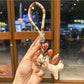 Keypus squirrel charm keychain close-up highlighting its painted eyes and nose