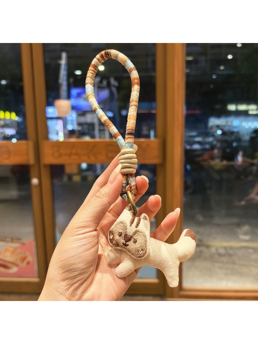 Keypus squirrel charm keychain close-up highlighting its painted eyes and nose