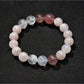 Lovra minimalist beaded bracelet paired with other simple jewelry on wrist