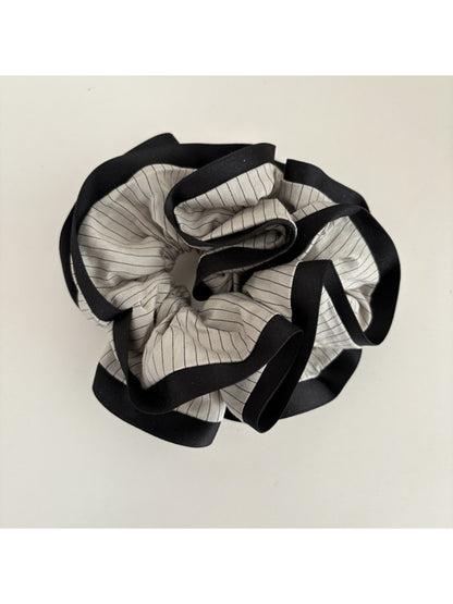 Gifty Neat Silky Zesty Scrunchie in bright yellow with subtle sheen under light