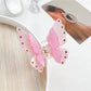 Butterfly claw clip displayed alongside matching pastel pink hair accessories