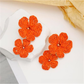 Earedge floral pendant raffia drop earrings displayed with matching accessories
