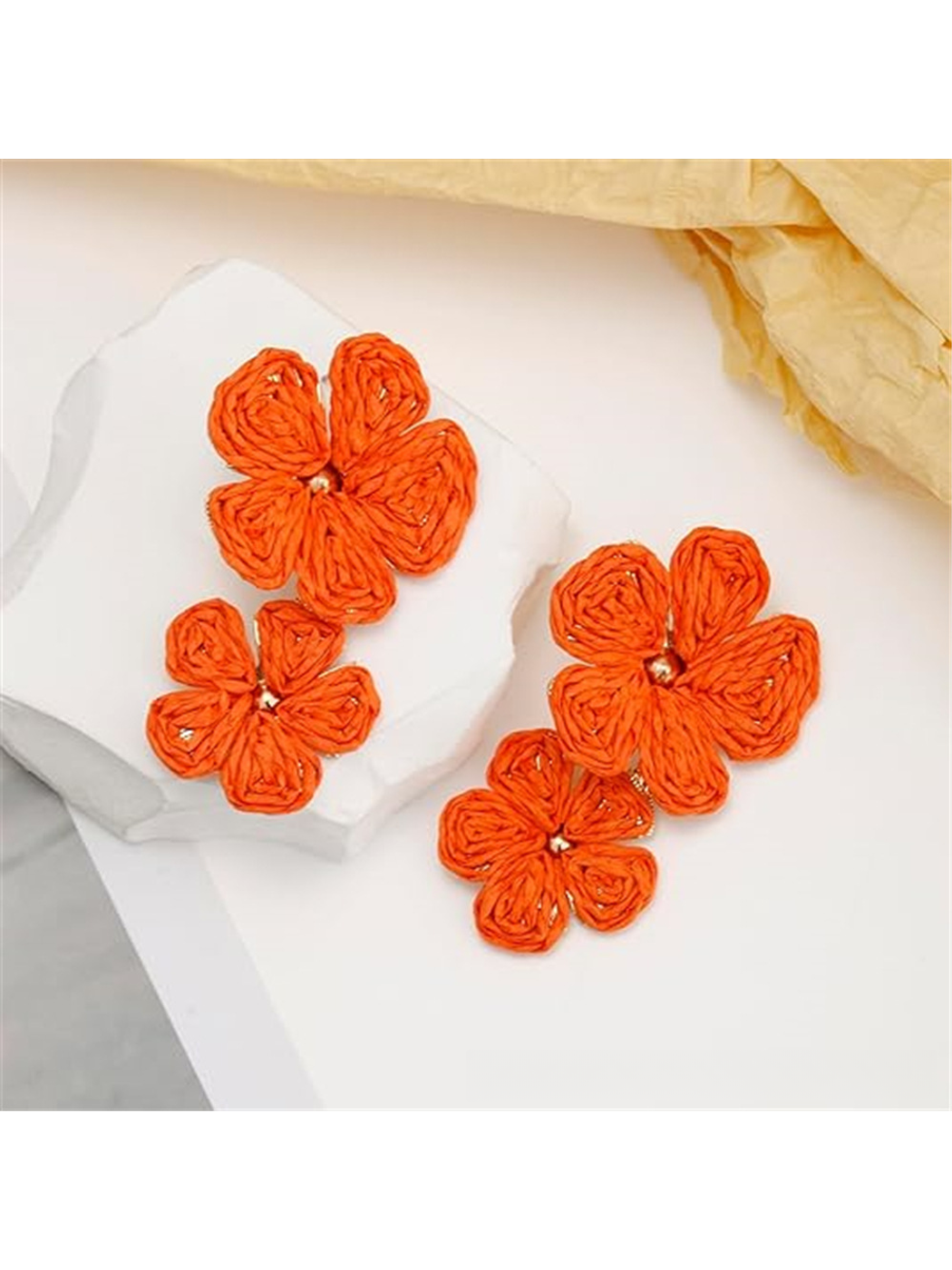 Earedge floral pendant raffia drop earrings displayed with matching accessories