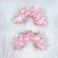 Close-up of Beau wavy pink hair clip with glossy finish on white background