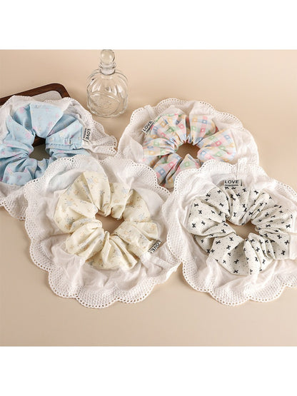 Gifty sweet printed patchwork scrunchie with floral and geometric patterns on fabric