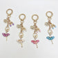 Delicate ballerina charm keychain with pink tutu and gold-tone metal ring