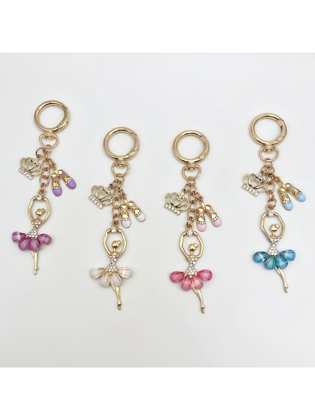 Delicate ballerina charm keychain with pink tutu and gold-tone metal ring