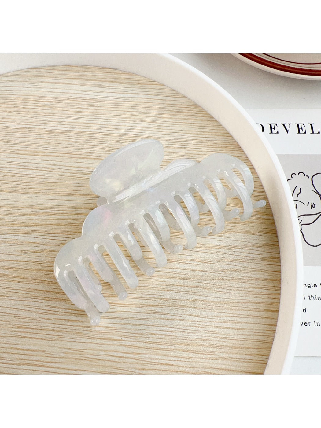 Beau claw clip holding thick hair in a secure grip from the back