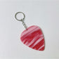 Keypus textured teardrop charm keychain shown with a minimalist white backdrop