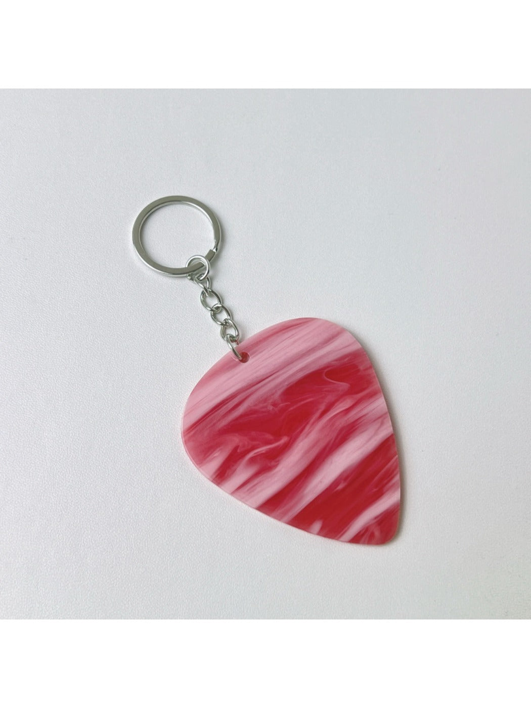 Keypus textured teardrop charm keychain shown with a minimalist white backdrop