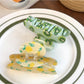 Side view of Beau fruit print hair claw clip with curved teeth