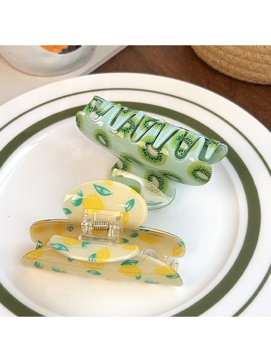 Side view of Beau fruit print hair claw clip with curved teeth
