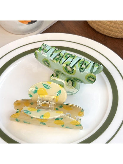 Side view of Beau fruit print hair claw clip with curved teeth