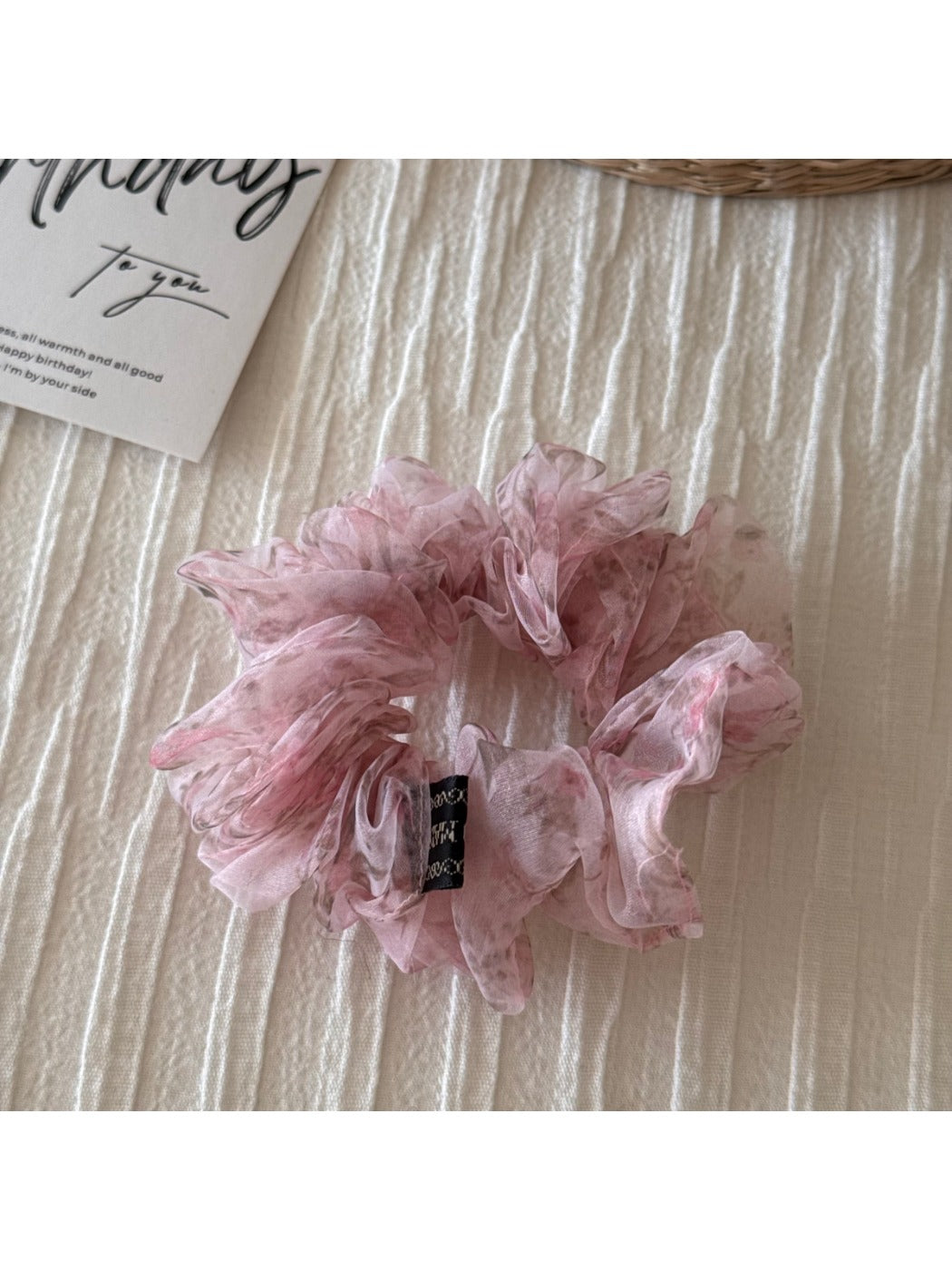 Multiple scrunchies stacked showing variety of floral patterns
