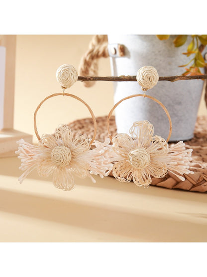 Detailed shot of woven raffia material in Earedge circle flower earrings