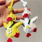 Side view of the duck keychain highlighting its smooth plastic texture