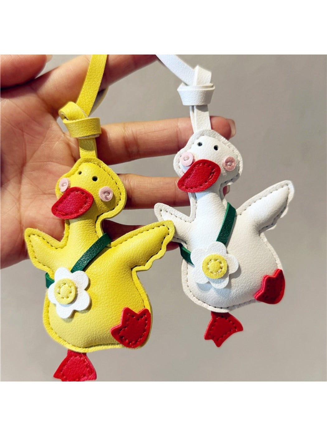 Side view of the duck keychain highlighting its smooth plastic texture