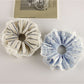 Close-up of Gifty striped scrunchie showing fabric texture and pattern