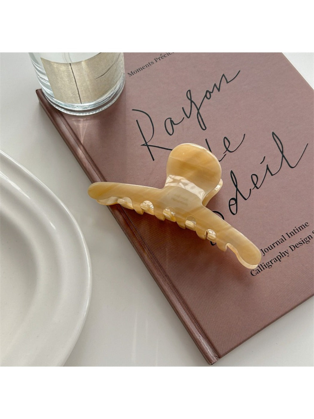 Beau claw clip shown from top angle emphasizing smooth edges and shape