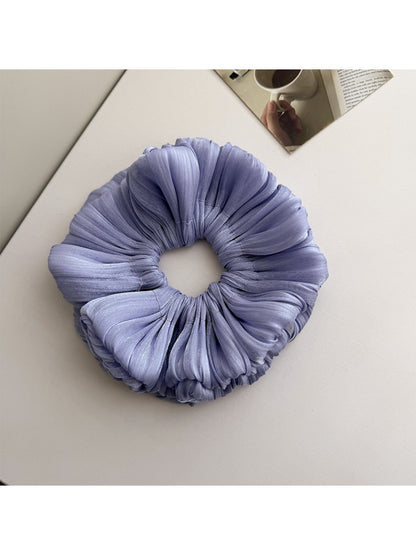 Gifty shimmer scrunchie styled in a ponytail with shiny layered fabric