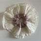 Close-up of lace fabric layers and stitching on the scrunchie