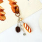 Mini baguette keychain displayed on a white background with soft shadows