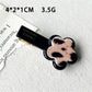 Beau flower and heart acrylic hair clip packaged in clear plastic box
