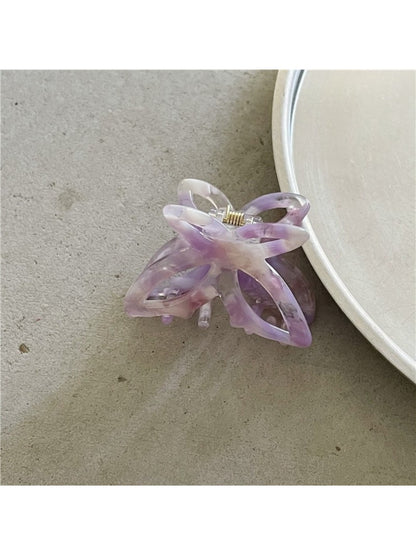 Beau Misty Acetate Butterfly Hair Clip clipped in blonde hair