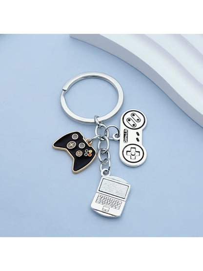 Close-up of Keypus keychain showing detailed buttons and joystick on game controller design