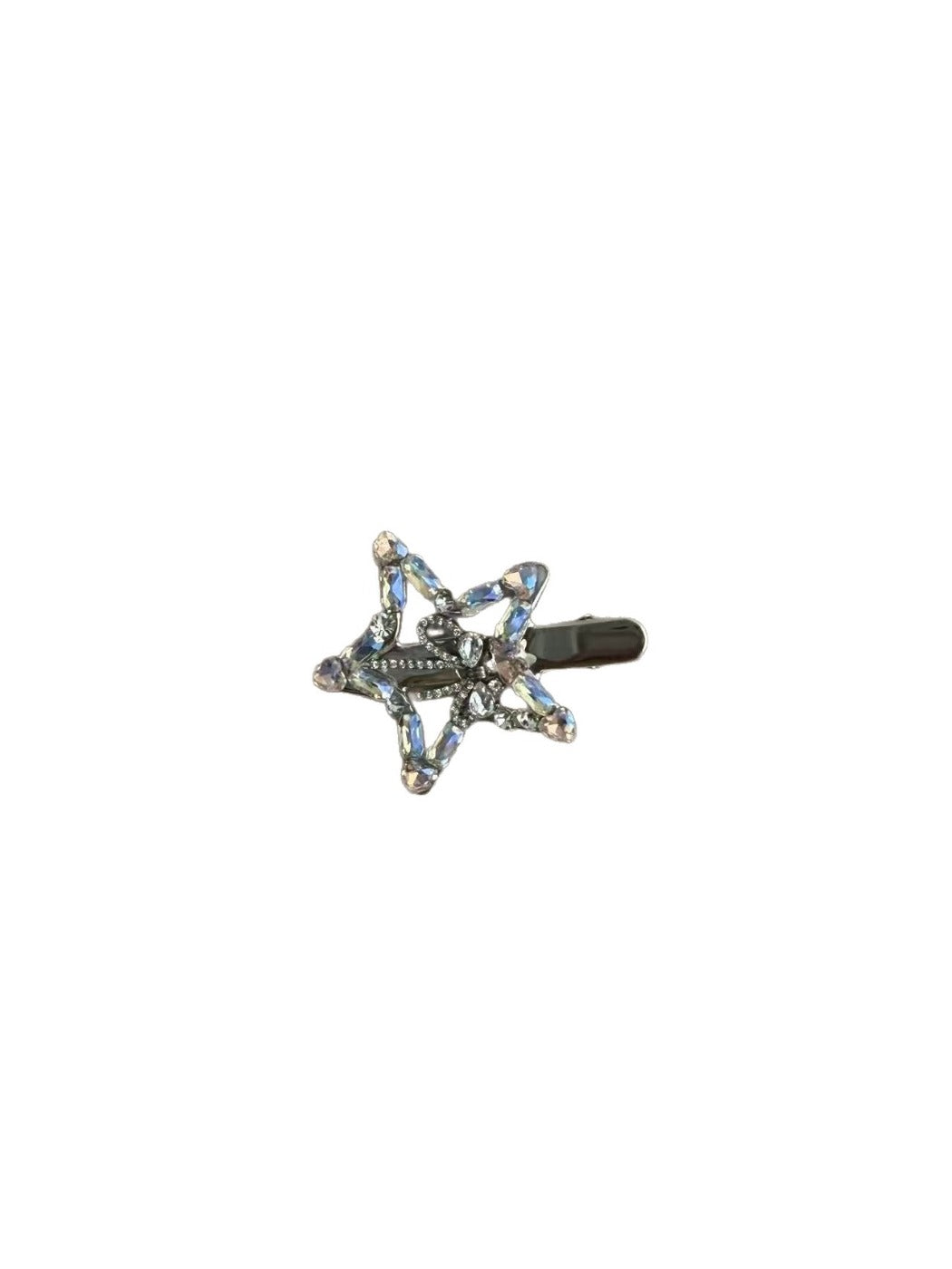 Beau hair clip shaped as a five point star adorned with rhinestones on a white background
