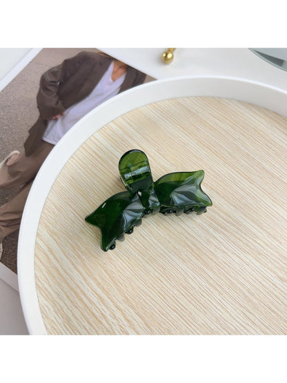 Beau hair claw clip displayed alongside matching pastel hair accessories