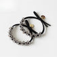 Multiple Gifty minimalist beaded hair ties displayed in a row with varied bead colors