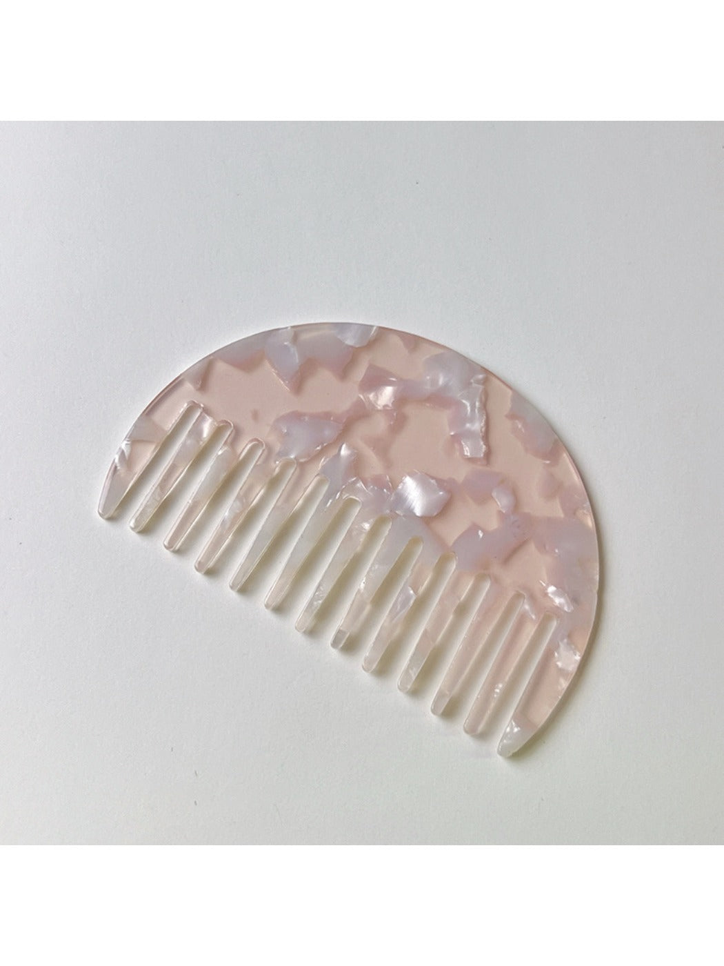 Camerow half round hair comb angled to show curvature and design