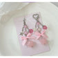 Pink star-shaped keychain with a bow attached to a silver keyring