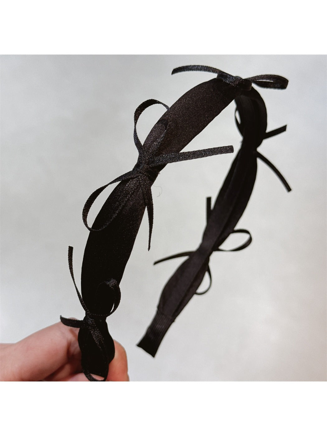 Gifty sweet ribbon bow headband styled with casual outfit on model
