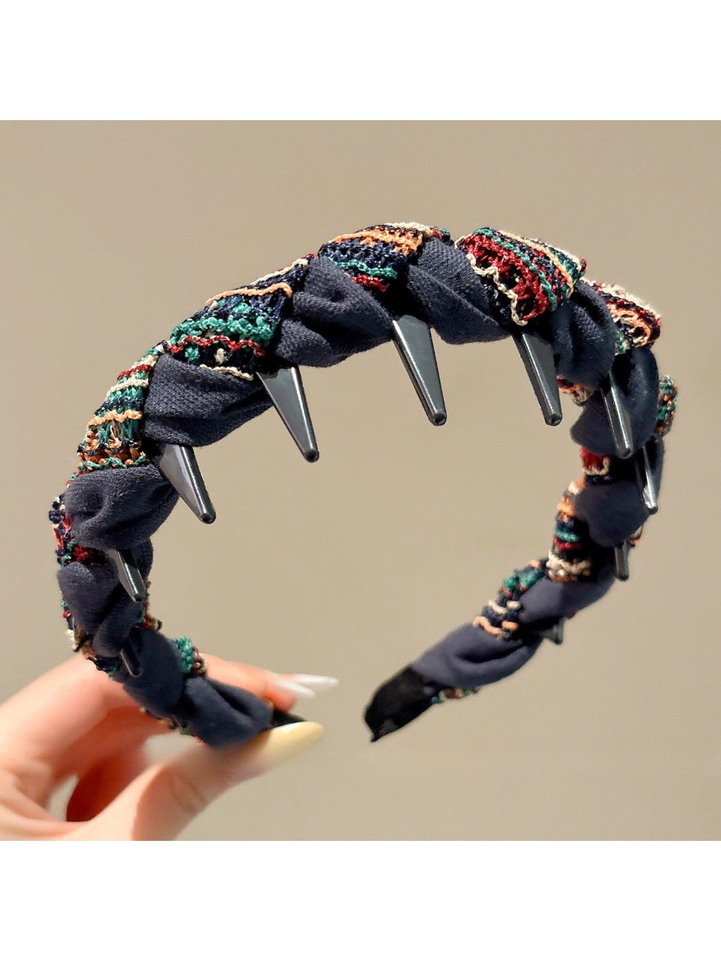 Close-up of Gifty fabric headband showing wave texture and stitching details