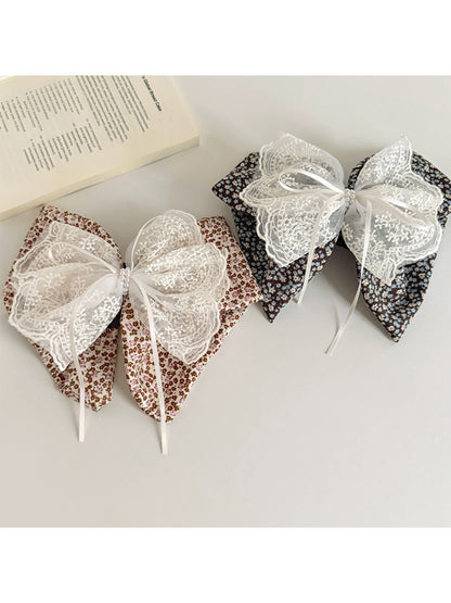 Close-up of Beau floral lace bow claw clip showing lace details