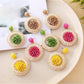 Close-up of Earedge creative raffia woven earrings with intricate natural fiber design