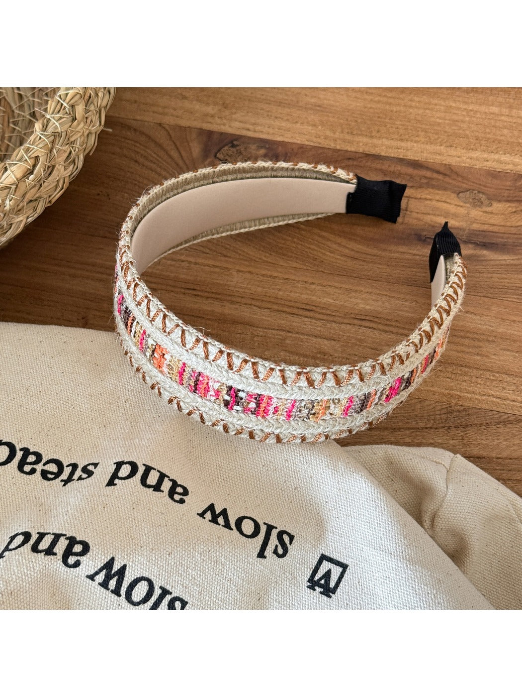 Gifty vintage wide edge woven headband styled on a mannequin head with a neutral background