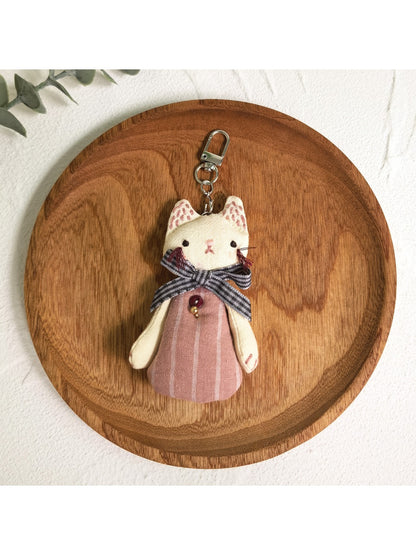 Silver cat charm keychain with engraved whiskers and eyes detail